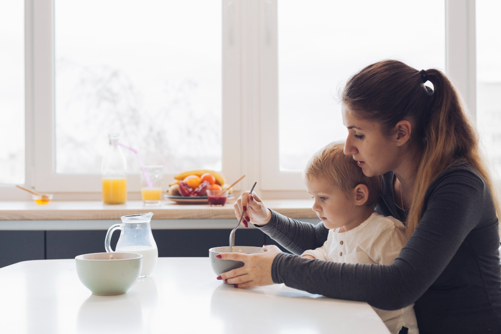 parent eating with baby
